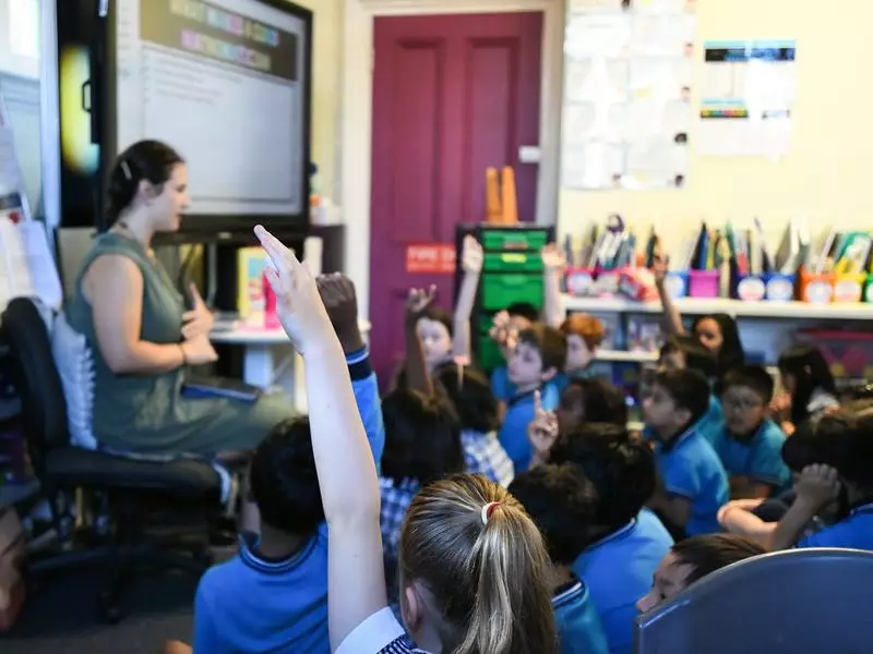 A teacher exemplifying one of the 10 essential classroom management skills as her class is focused and organised.